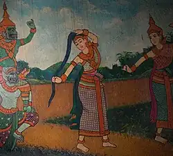 Wat Phnom Mural: Preah Thorani placing herself between the demons and Gautama Buddha