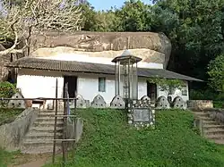 Entrance to the temple at the foot of the rock