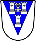 a pile—Argent, on a pile azure three towers, two and one, of the first, in the middle chief point two keys in saltire, wards upwards and inwards, or—Otley Urban District Council, England
