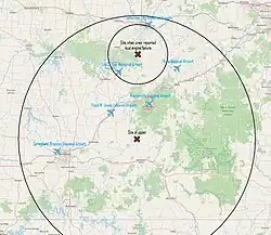 A map of Southern Missouri with labels for six different airports. There are two markers on the map, one indicating the site of the upset located near the center, and another located closer to the top of the map. Two circles are centered around the markers, with the larger circle centered on the middle marker and encompasses all six airport labels while the smaller circle is centered on the upper marker and only encompasses one airport label.