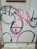 Phallic graffiti in Montevideo, Uruguay. It is overwritten with the text Me cuidan lxs pibxs no la policía (transl. The [neutral gender] guys protect me not the police)