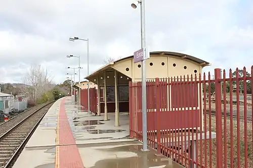 A view of Platform 1 looking south, showing the station shelters on that platform