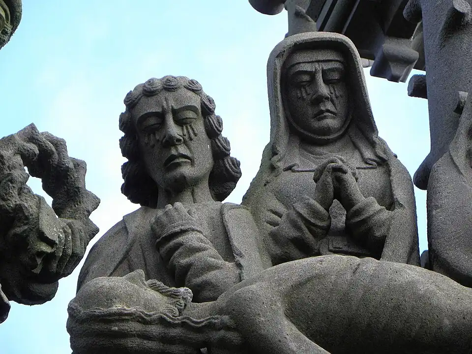 Tears run down the cheeks of two of the onlookers at the "mise au tombeau".