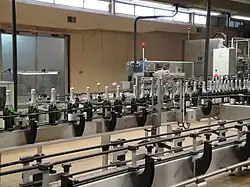 Automated labeling line for wine bottles