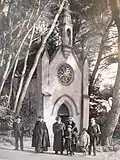 Paul and Minnie Bourget in front of the chapel.