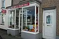 A Polish shop in Penllyn, the bilingual sign of which, 'Deli Pwylaidd Polish Deli', incorporates Welsh and English