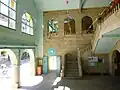 Entrance and central interior staircase.