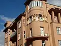 ”Villagers” by Ivan Meštrović on the facade of one of the buildings on Square