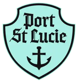 A black on aquamarine crest depicting an anchor.