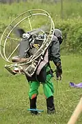 Note that it is pilot who is thrust and tugs the kite lines.