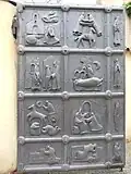 Metal gate to the park from Alfa Passage depicting scenes from the life of St Francis of Assisi