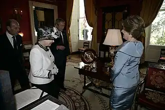 The royal couple and the presidential couple exchange gifts in the Red Room