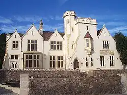 photo of a large white Victorian mansion