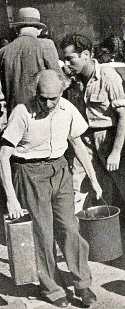 Mathematics professor Michael Fekete, the Provost of the Hebrew University of Jerusalem, with his water quota during the siege of Jerusalem