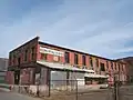 Warehouse that no longer exists which stood just west of the Jack Kerouac Lofts.