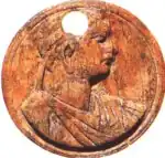 1st-century Roman ivory game counter with an imaginary portrait of Ptolemy XIV. An inscription in the back reads άδελφός Κλε(ο)πάτρας ("Cleopatra's brother").[1]