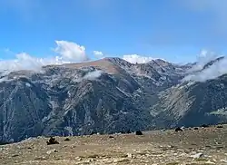 The east face of Puig de Campcardós (centre). The Campcardós valley is to the right of and below the summit.