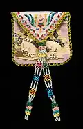 An early 19th-century Mexican handbag featuring a lamb and crown motif in traditional needlework and a silk dress lining[35]