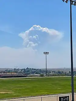 The fire producing a pyrocumulus cloud while burning in the Bradshaw Mountains