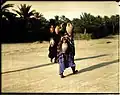 Qatifi women on their way to tend farms, 1935