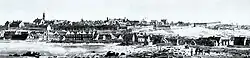 An illustration of Quebec City, with many buildings surrounding the waterfront to the bottom left. City walls may be observed in the background.