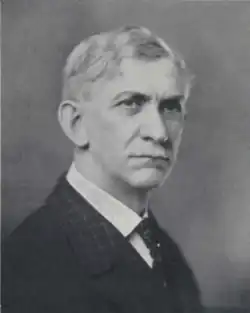 the article subject dressed in a jacket and necktie