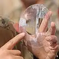 Round protractor flexed in hands