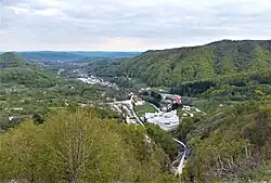 View of Bistrița village, with Bistrița Monastery in the foreground