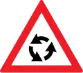 Crossroads with roundabout ahead