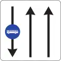A Lane on a road going down with bus lane