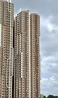Residential high-rise building with a beige exterior.