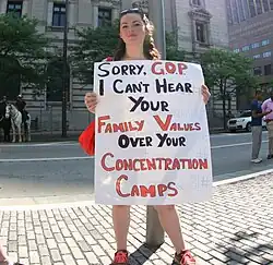A protester compares child detention by the government to the Nazi concentration camps