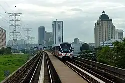A train of the Kelana Jaya line passing through Asia Jaya