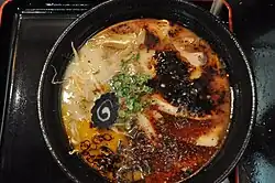 Tonkotsu ramen with black garlic and chilli from a ramen stand at the museum[which?]