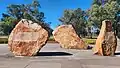 Stone Artworks (South face)-The left work is by Ruby Florence Hammond (1993), the middle work is by Robert Lee (2003) and the right work is by Wenten Rubuntja (1988)