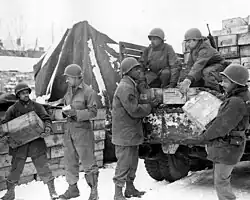 Soldiers of the 4185th Quartermaster Service Company loading Red Ball Express truck, Liège, Belgium, 1944