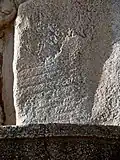 Faint, if not unrecognizable remnants of what seems to be a throne of an Elamite king. Sasanian reliefs eliminated the Elamite remnants