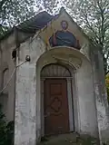 Chapel on the church grounds with mural