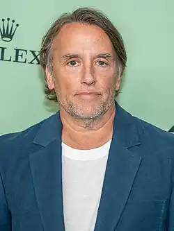 Linklater, neutrally looking at the camera