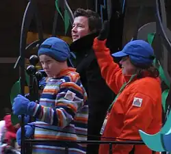 Astley on a parade float with children