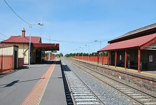 View from Platform 1 looking east, showing the station buildings on each platform
