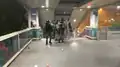 At 12:30 a.m., large numbers of riot police ascend the footbridge.