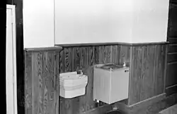 Two drinking fountains side by side, recessed in a wall