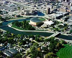 Aerial view of buildings, parkland and the river in downtown Rochester
