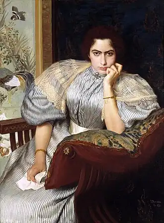 A seated woman in a striped blue-and-white dress with puffed sleeves holds a crumpled letter in her right hand, gazing at the viewer. Behind her, a decorative panel with birds and plants. The artist's signature and the date "Rio, 1895" appear in the lower right corner.