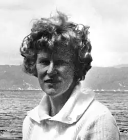 Crop of head and shoulders - black and white, Bailey has short curly hair.