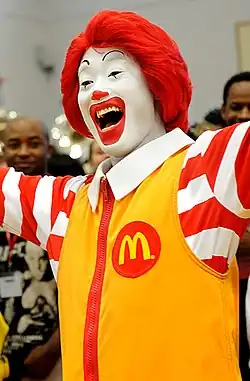 A picture of Ronald McDonald smiling.