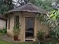 Outside of a rondavel for backpackers