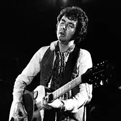 Lane performing with Slim Chance, 1975
