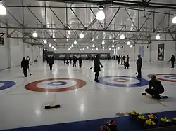 Curlers at play in a mixed recreational league
